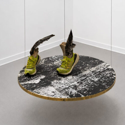 Disco Lunar #1, Self-Portrait Protecting Ío, 2025 Offset ink, sand, and feathers on Kozo maruflado paper mounted on canvas. Resin, feathers, and sneakers 35 3/8 in diameter (90 cm diameter)